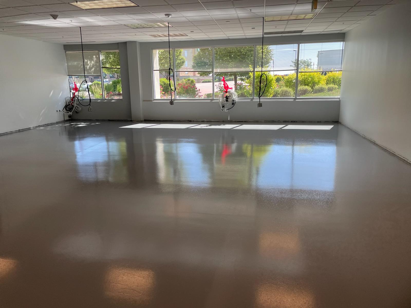 Smooth reflective epoxy flooring in commercial space — epoxy flooring Thornton CO